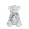 Strap and dotted cotton fabric teddy bear with bowtie toy