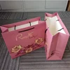 Cheap Price Custom Logo Design CMYK Printing Fashion Shopping Retail Gift Paper Bags With Ribbon Handle