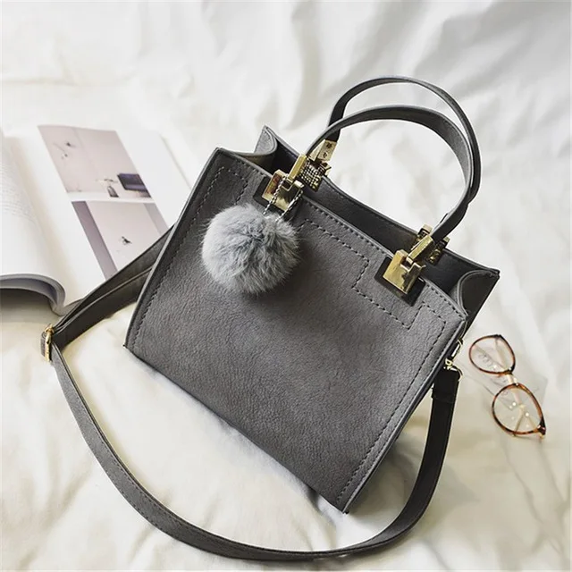 grey suede handbolsa