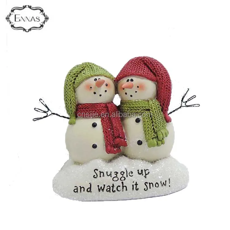 The polyresin Christmas  gift  which snuggle up watch snow' snowmen on base(m2)