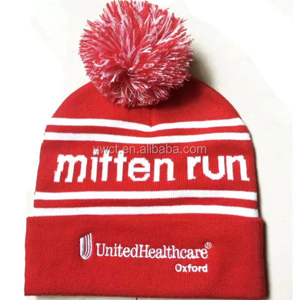 fitted hat with fur ball