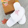 China manufacturer custom logo cheap white terry hotel slippers