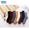 Custom wholesale winter soft comfortable cosy plain unisex warm fuzzy socks