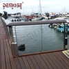 Stainless steel deck cable railing with timber handrail