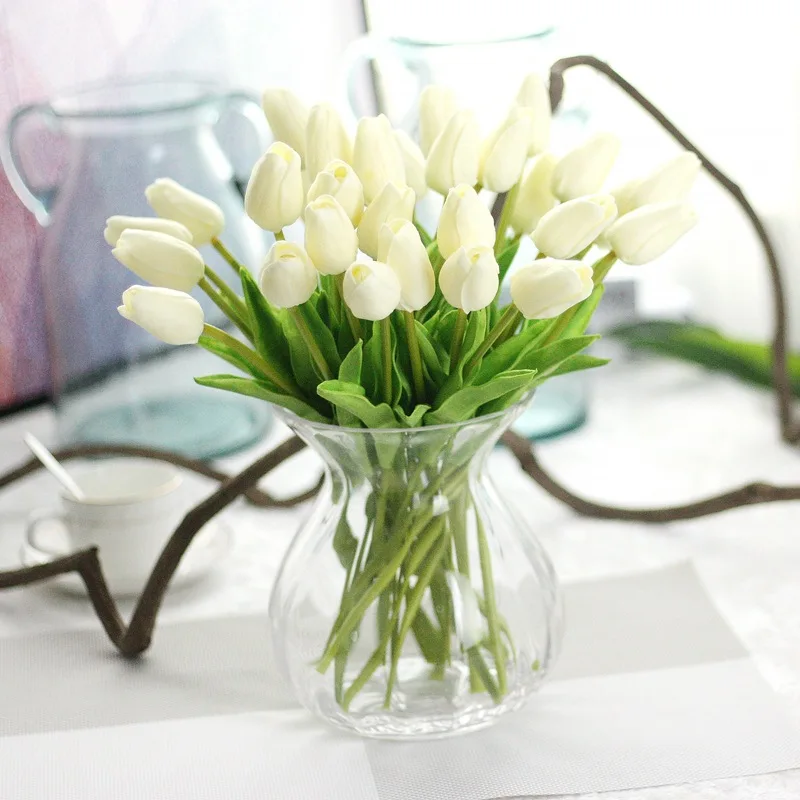 artificial flowers in glass vase