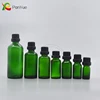 Green Essential Oil glass bottle with childproof cap for cosmetic