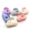 small acrylic hair claw with word