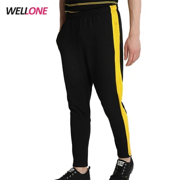 black joggers with yellow side stripe
