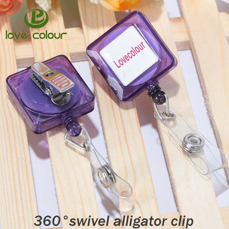 Badge reel with alligator clip