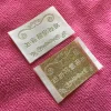 glossy satin woven label with metallic thread logo
