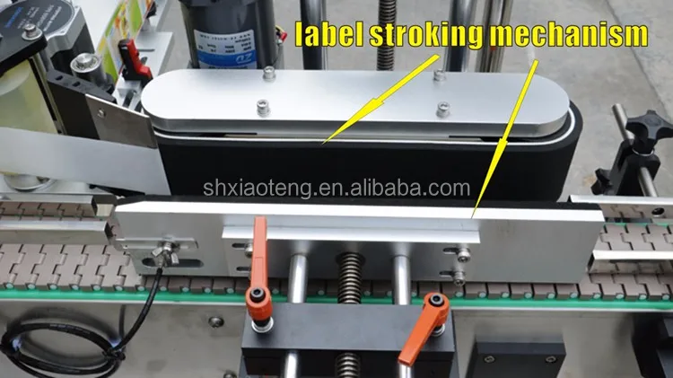 label stroking mechanism