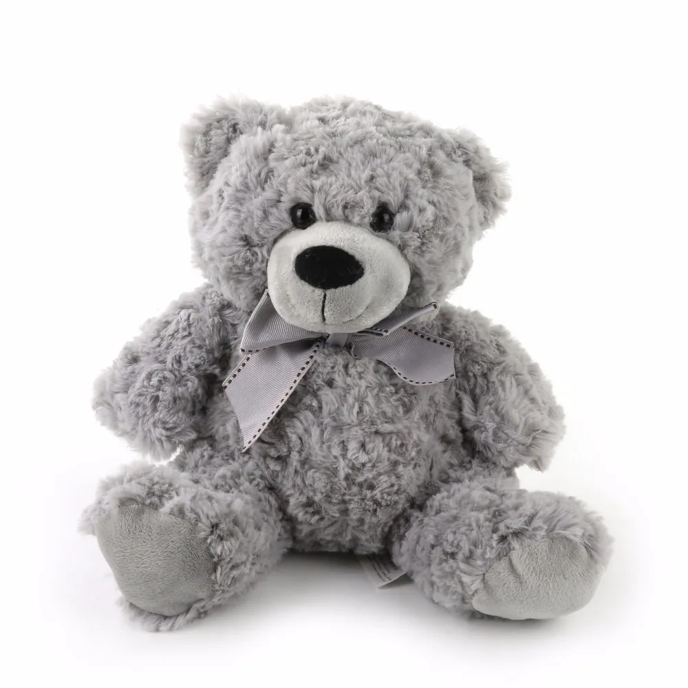 grey teddy bear with patches