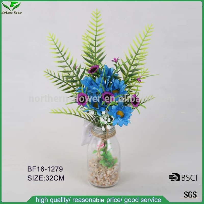 small artificial flowers in vase