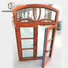 Large glass triple glazed wooden arched top window