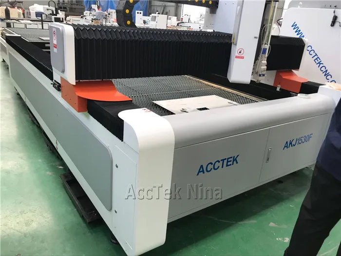 China 1000W fiber laser cutting machine cut 12mm carbon steel with exchange table