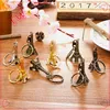 promotional customized cartoon Eiffel Tower shaped car metal key chain key ring ,keychain free samples online shopping