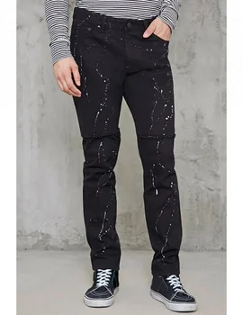 ripped jeans with paint splatter