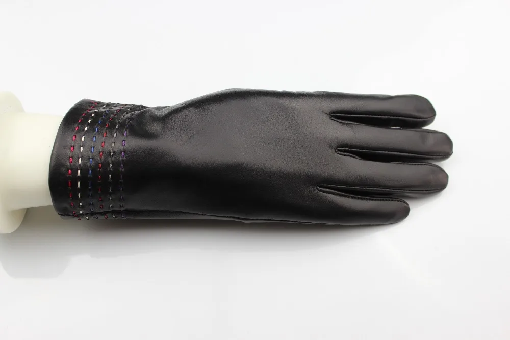 Black leather gloves with many special design stichings at the bottom