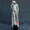 famous stone beautiful nude lady statue with wind coat