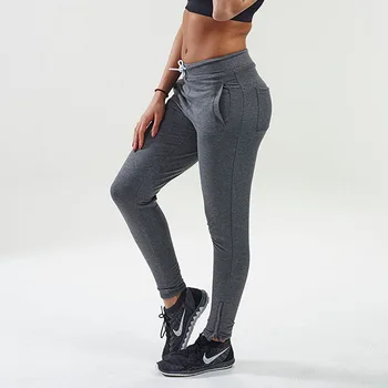A black pair of women's sweatpants with a drawstring waist and high waistband