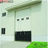 sectional industrial door opened passing small