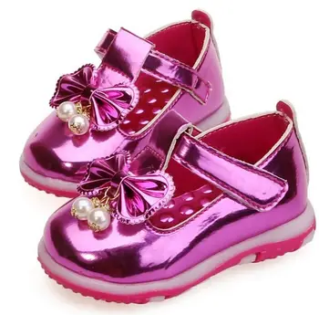 grey and pink football boots