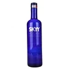 Fancy empty tequila glass blue wine bottle