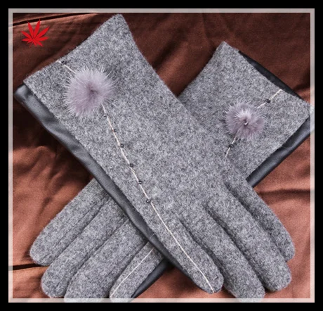 ladies back woolen and palm pu leather together style gloves have small fake fur ball