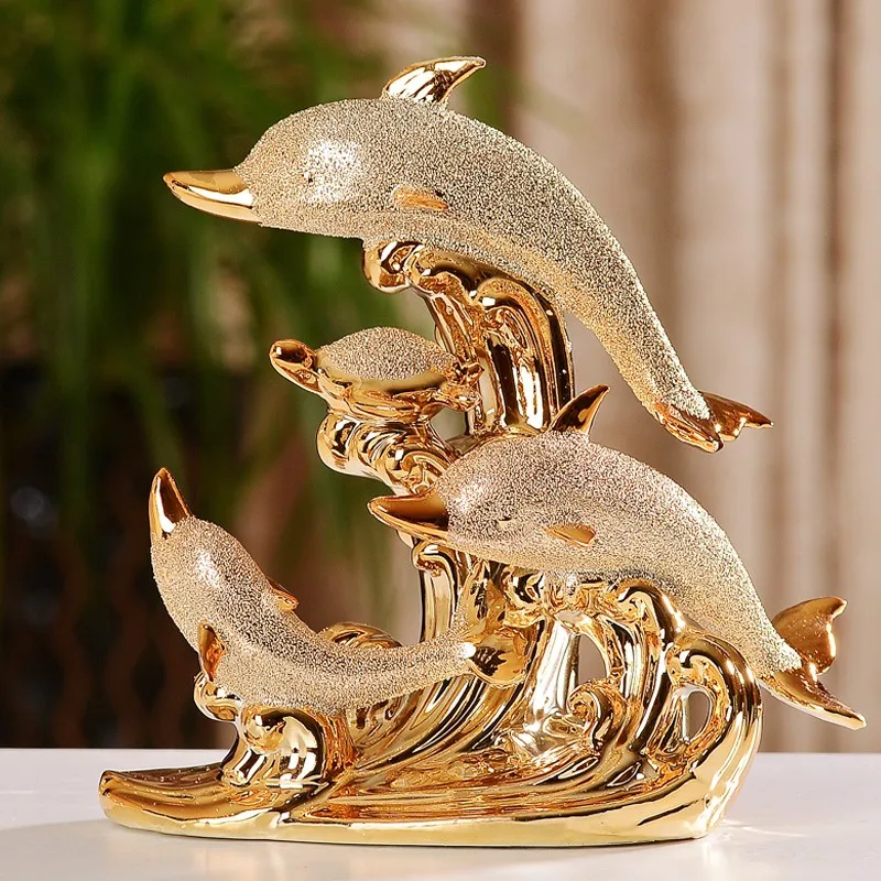 gold dolphin statues