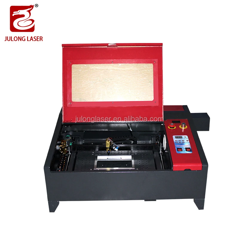China CO2 wood laser cutter&laser engraver / acrylic board cutting machine manual up and down table with good price