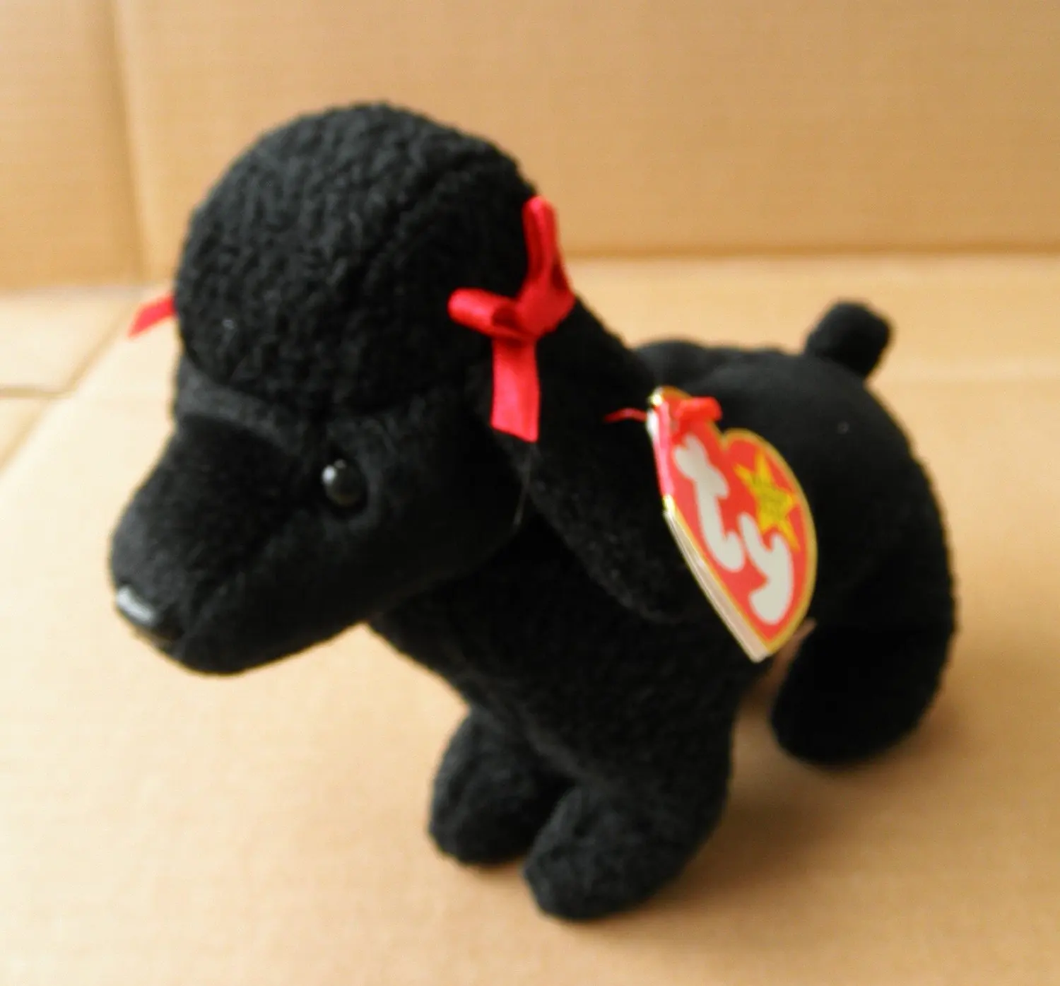 black toy poodle stuffed animal
