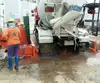 Automatic truck wheel pressure washer