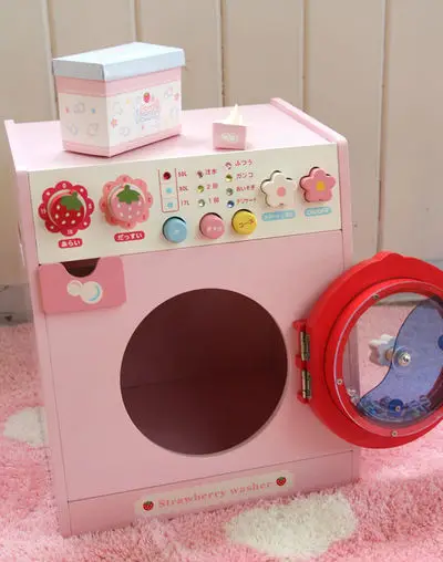 pink wooden kitchen with washing machine