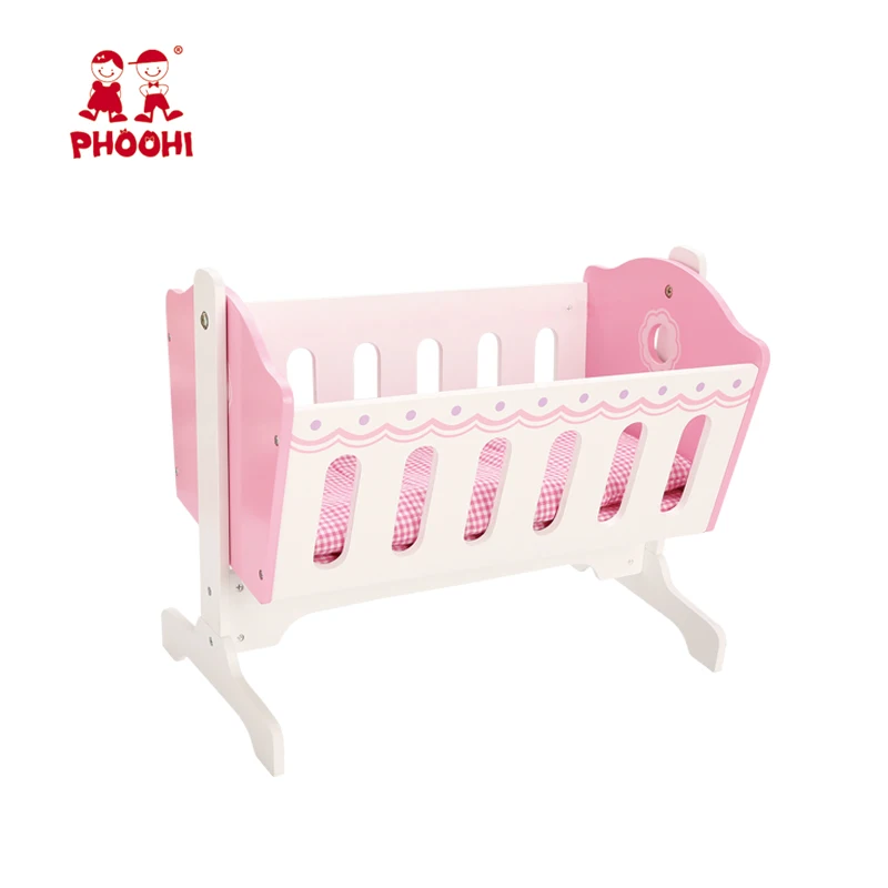 white wooden doll cradle