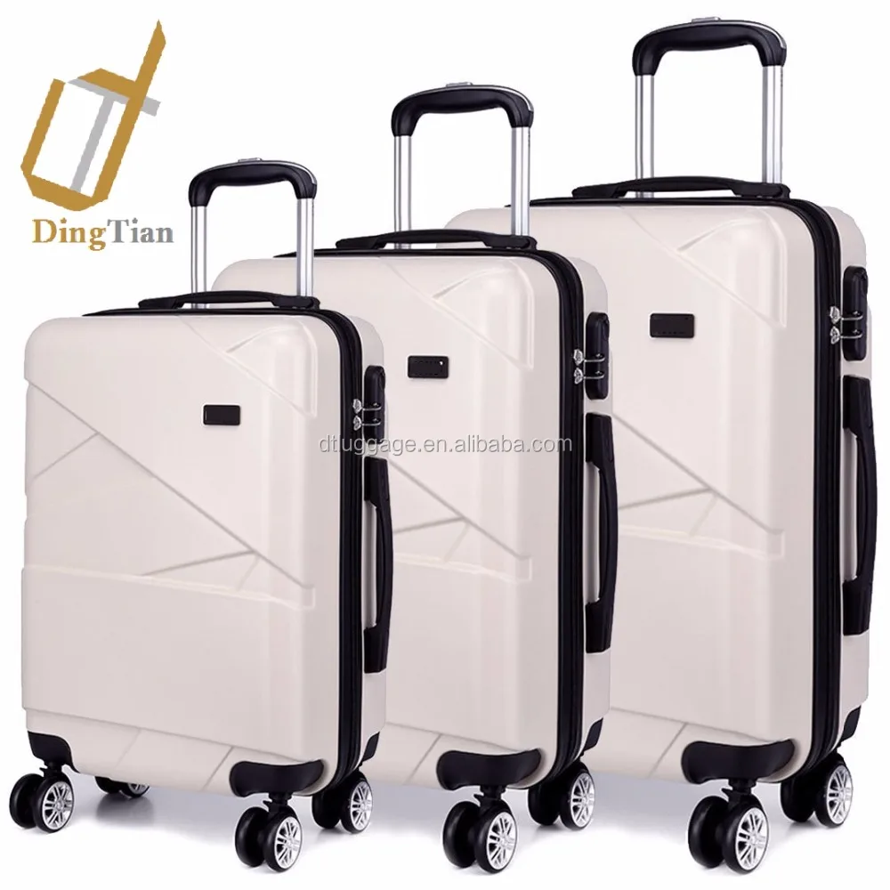 white suitcase carry on