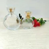 /product-detail/20ml-30ml-50ml-100ml-flat-round-glass-perfume-bottle-with-golden-crystal-cap-60766493974.html