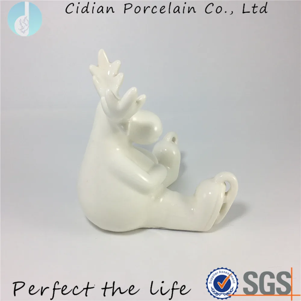 white ceramic reindeer figurine