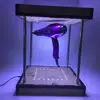Magical levitating display for advertising creative magnetic levitation floating and rotating hair dryer display stand