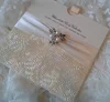elegant and sophisticated floral embossed wedding invitation pocket card with stain ribbon ang vintage crystal