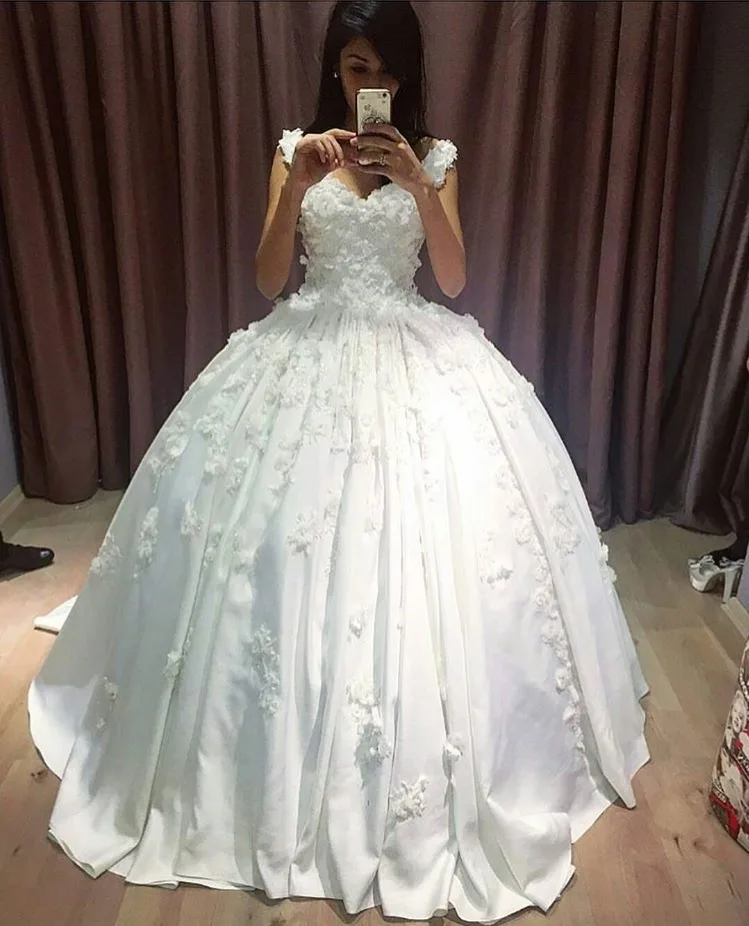 white satin ball gown wedding dress