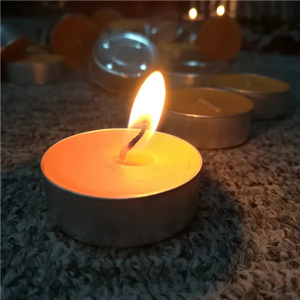Orange scented colored handmade tea light candles