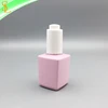 Beautiful 13ml empty rectangle pink unique cosmetic oil bottle with white push pump lid for essence and serum