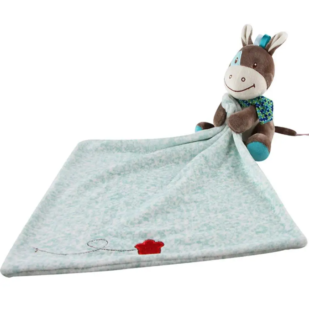 blanket with stuffed animal attached