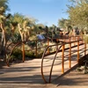 Contemporary design pedestrian bridge with corten and wooden handrail