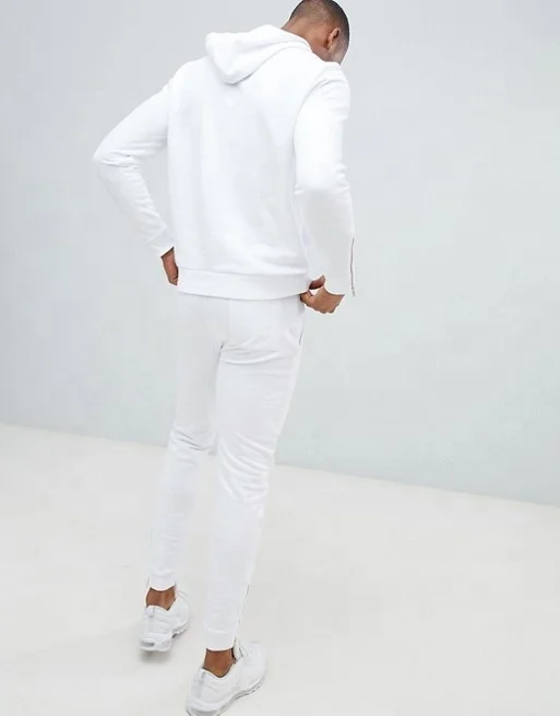 white and gold jogging suit