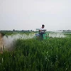 Multi function pedestal type fertilizer spreading machine small four wheeled car loading spraying machine