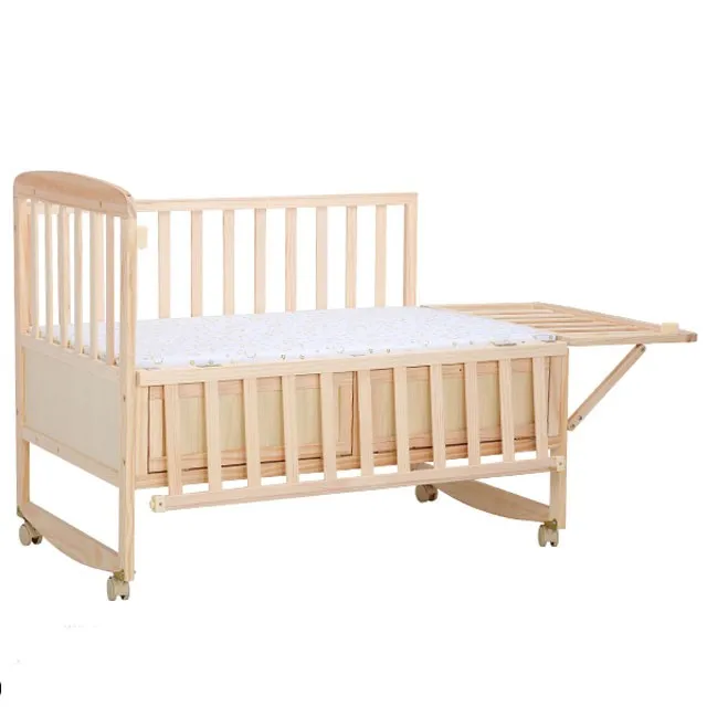 baby bed beside bed