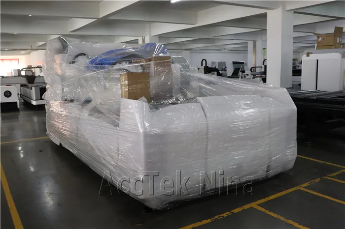 China 1000W fiber laser cutting machine cut 12mm carbon steel with exchange table