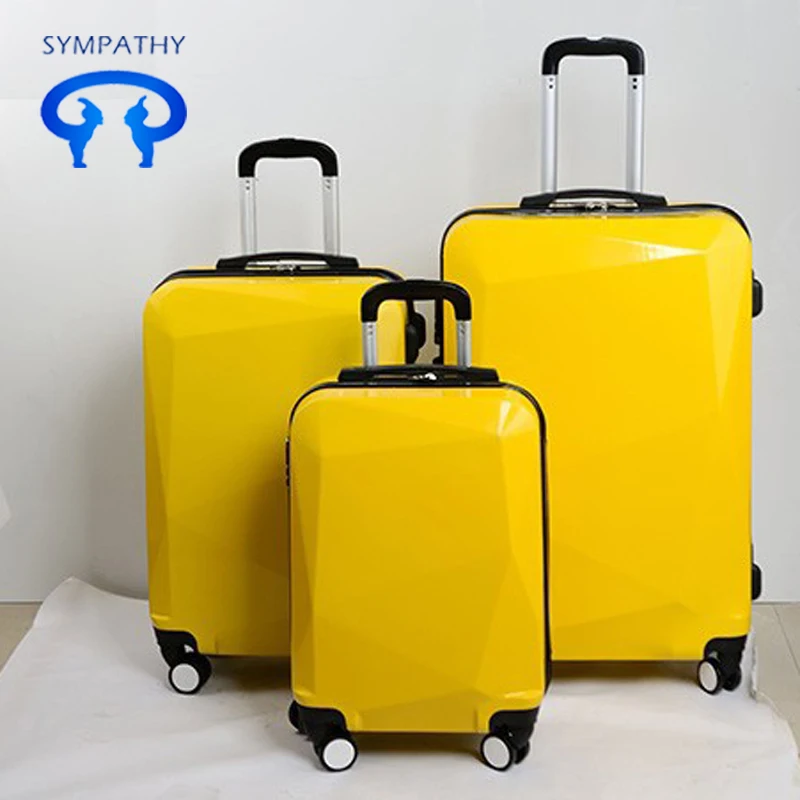 yellow hard shell suitcase