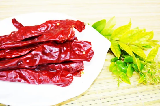 small round red hot fresh cherry chili peppers